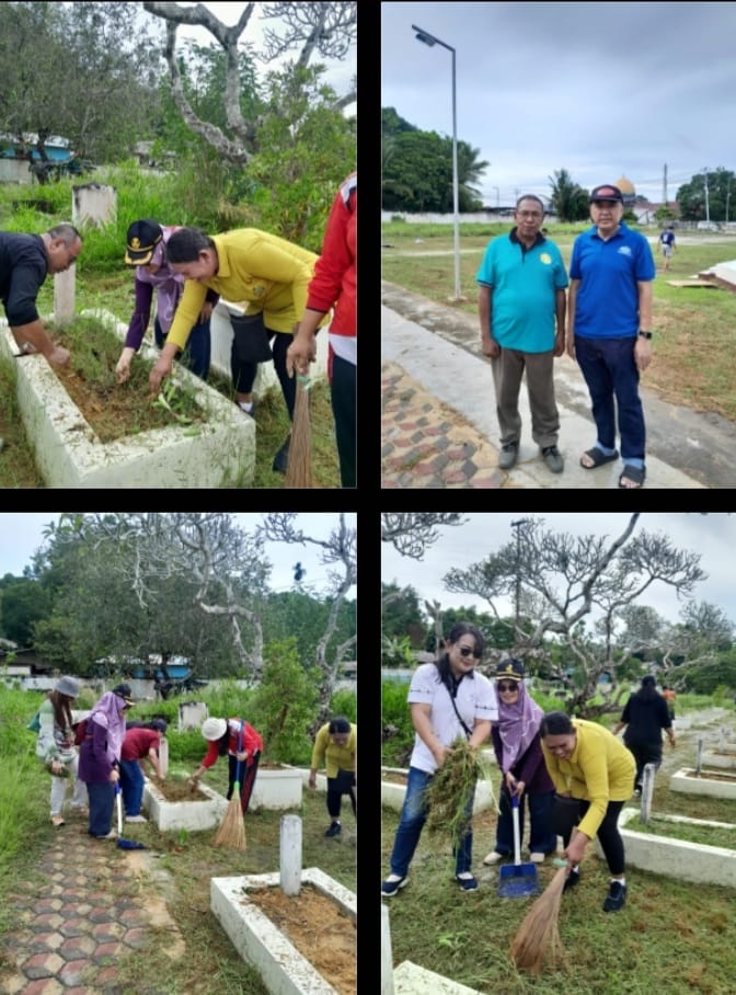 Ketua Panitia Waisak Bersama, Herry Karnadi dengan memotong dan mengangkut sampah tanda dimulainya kerja bakti bersama